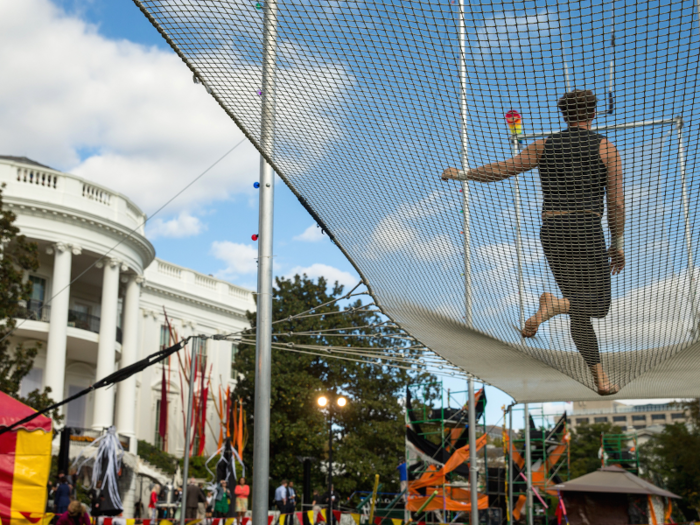 Trapeze artists danced alongside children as President Obama and First Lady Michelle Obama welcomed everyone to the White House for Halloween in 2015.