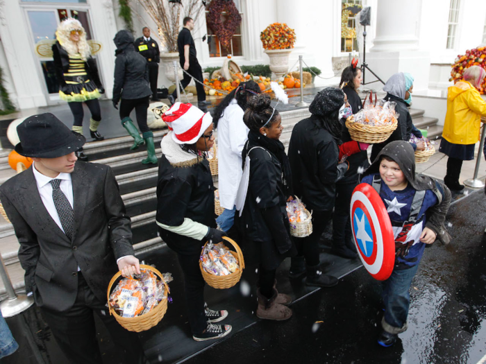 Even though it was snowing, children from the Washington area and from military families delighted in trick-or-treating at the White House on Halloween 2011.