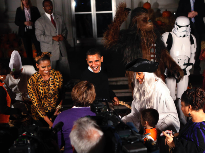 President Barack Obama and First Lady Michelle Obama handed out candy to kids at the White House on October 31, 2009. The first family welcomed more than 2,600 children and parents from Washington, Maryland, and Virginia to the White House for a Halloween party.