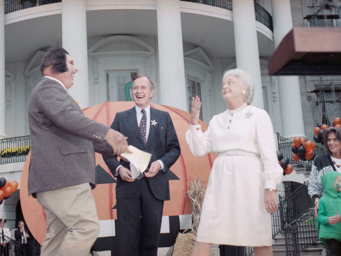 President George H.W. Bush and First Lady Barbara Bush joked around with TV personality Willard Scott during a Halloween party on the White House lawn in 1989.