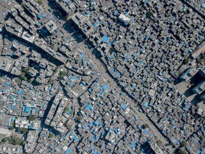 The Dharavi slum consists mostly of grey, concrete structures.