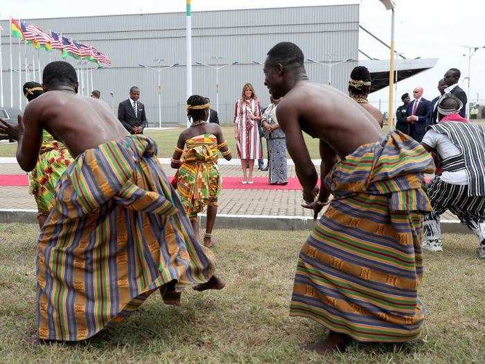 At the airport, the first lady was treated to a exhibition of dancing and drumming from Ghanaians in traditional dress.