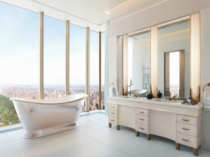 The walls and floors in master bathrooms are finished in veined white onyx, custom sconces, and bronze fixtures.