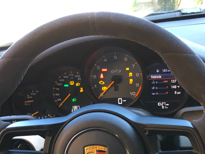 Beyond that is a traditional clear and concise gauge cluster. As with every Porsche, the tachometer is front and center.