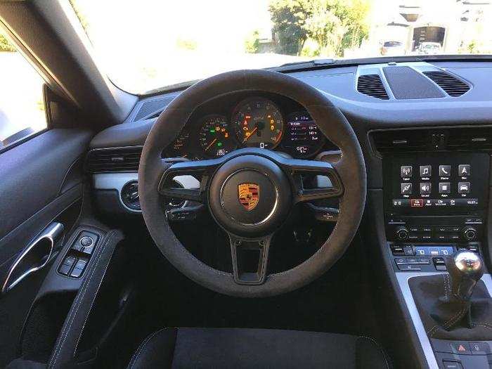 In front of the driver is an Alcantara steering wheel.