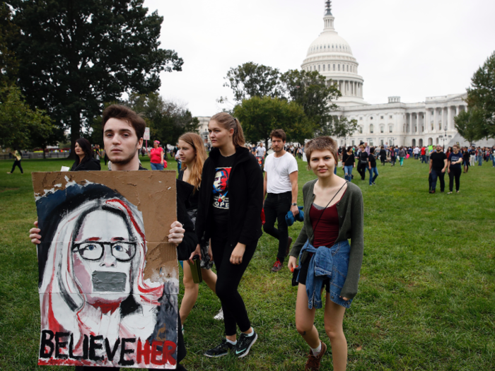 Demonstrators congregated outside the steps of the Supreme Court and the US Capitol building. Several held signs depicting Ford, who says a drunken Kavanaugh assaulted her when they were teenagers.