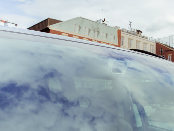 Also located above the rear-view mirror are the sensors for Subaru