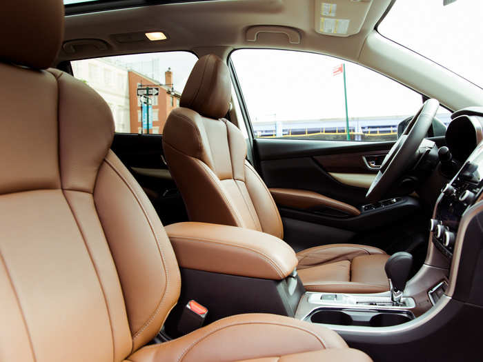 The dark tan leather and wood grain accents add an extra dash of luxury to the business-like cabin.