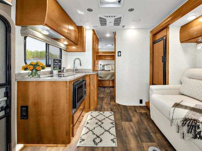 The Tiffin Wayfarer is built on a Mercedes-Benz Sprinter chassis and is equipped with a SumoSpring ride assist system, Mercedes safety package, frameless windows, and 5,000-pound hitch capacity.