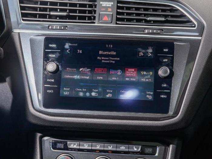 The center stack is dominated by an optional 8-inch touchscreen display running VW