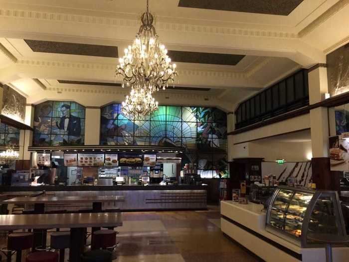 ... and chandeliers hanging down over the spacious dining room. It