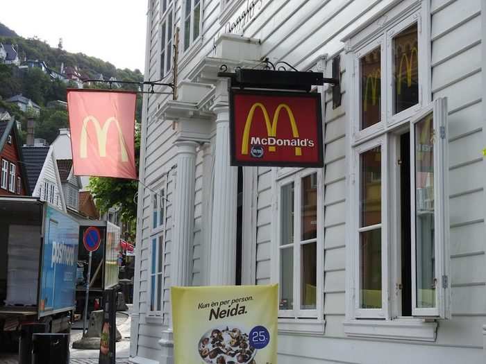 The exterior is white wood paneling, and the golden arches are a bit more subtle than at McDonald