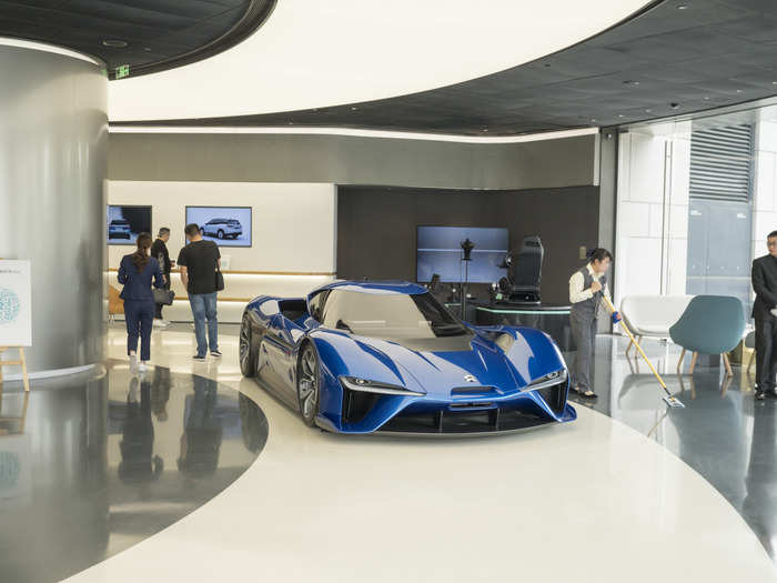 The bottom floor of the Nio House looks like a pared-down car showroom. While the company