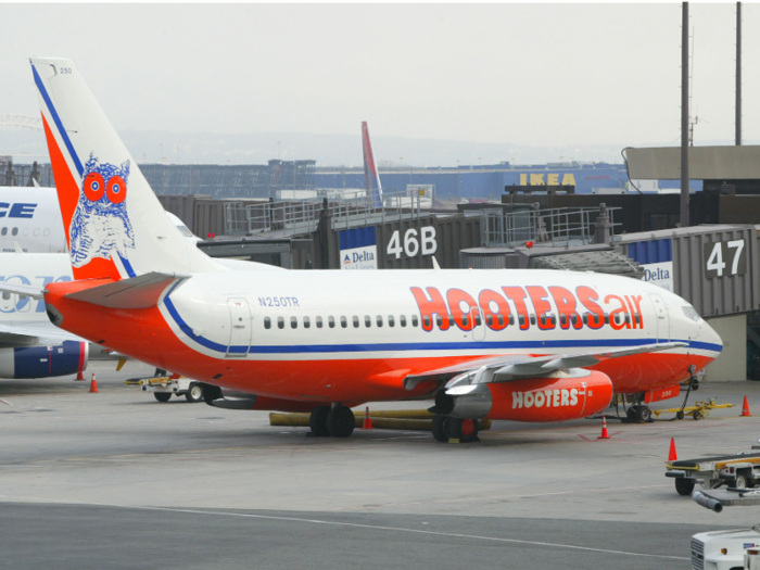 ... and repainted the airplanes with the company logo. Hooters Air soon took off.