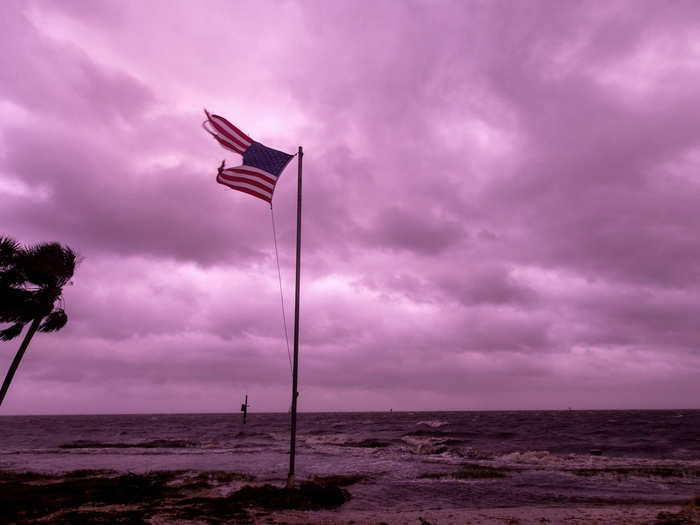 The hurricane has produced some eerie scenes, like this sunset at Shell Point Beach on Wednesday night.