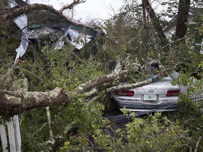 Downed power lines and debris mean that conditions remain dangerous.