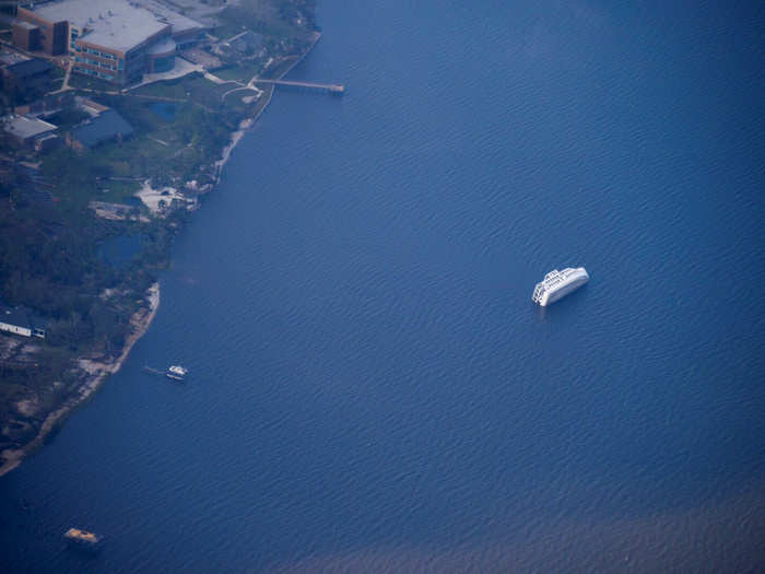 The storm caused widespread damage to boats moored in the region, including this vessel that capsized.