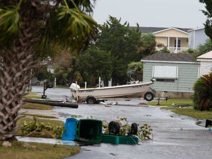 After: The community is ravaged by floods and fallen trees