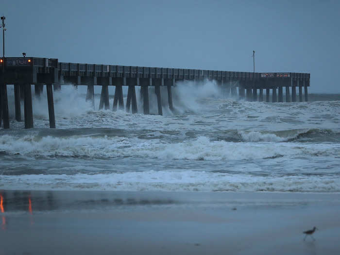 After: The pier endures the outer bands of the hurricane