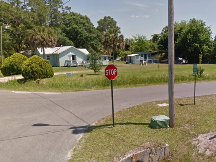 Before: The intersection of Howard Street and Tallahassee Avenue on a sunny day in Saint Marks