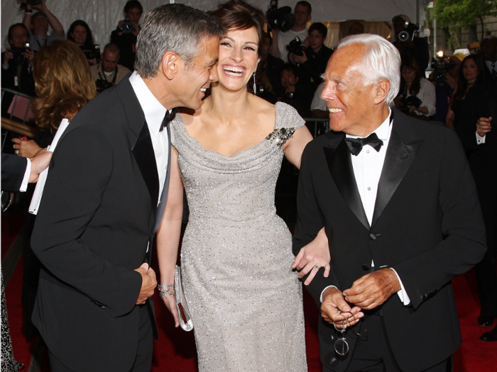 Armani is frequently photographed with George Clooney.