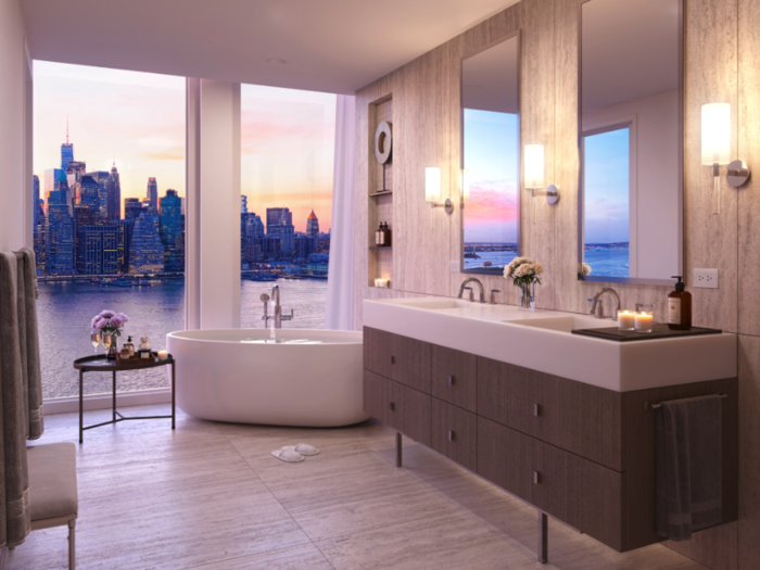 The bathrooms, as well as the kitchen, also provide sweeping views of the city.