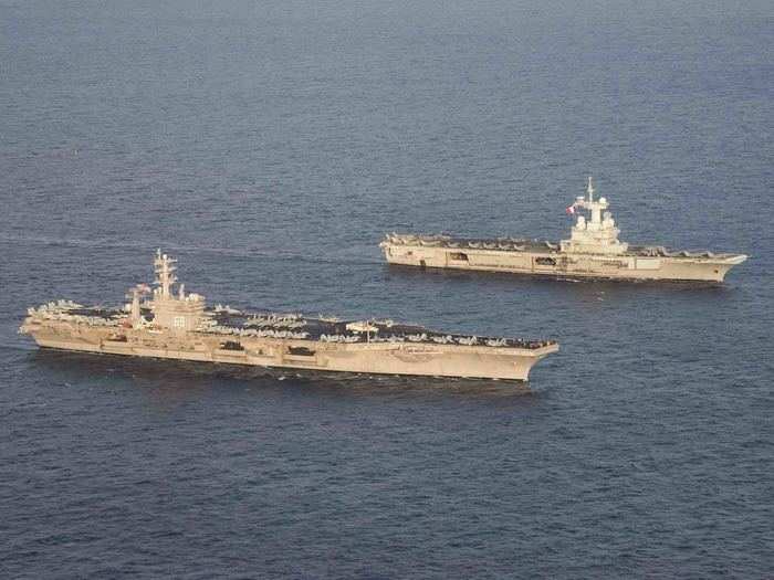 Both Nimitz-class carriers and the CDG have seen their fair share of combat, especially the former.