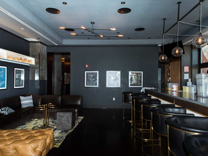 With the dark-colored walls and leather furnishings, the bar had the feel of a swanky lounge.