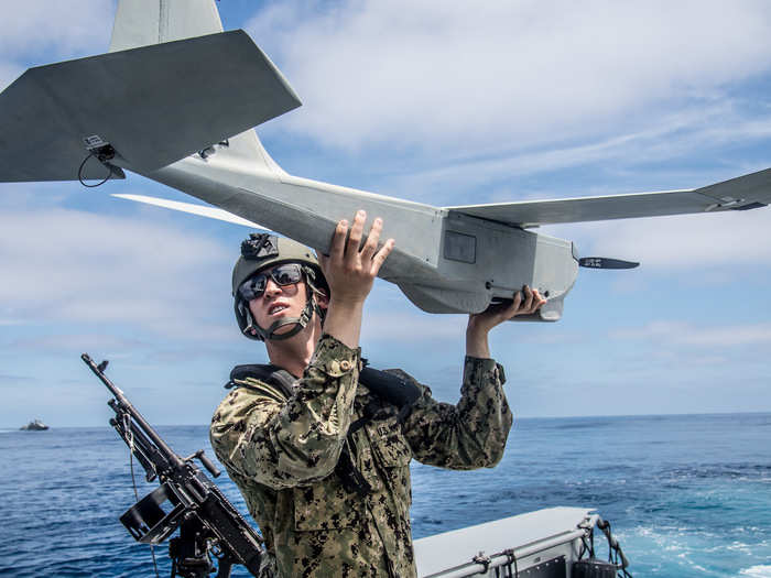 Operations Specialist 3rd Class Neil Wierboski, assigned to Coastal Riverine Squadron (CRS) 3, prepares the unmamned aerial vehicle for launch aboard a Mark VI patrol boat during unit level training conducted by Coastal Riverine Group (CRG) 1