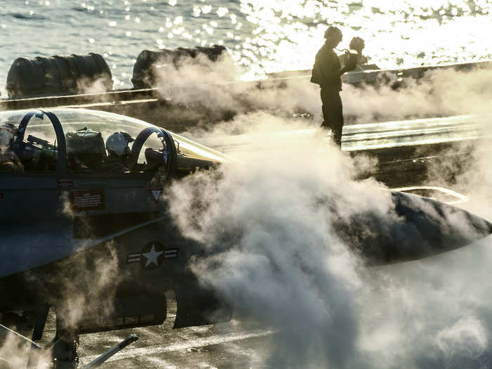 An F/A-18F Super Hornet, assigned to the Mighty Shrikes of Strike Fighter Attack Squadron (VFA) 94, prepares to launch from the flight deck of the aircraft carrier USS Theodore Roosevelt (CVN 71) on Dec. 21, 2017