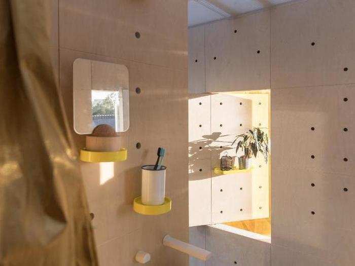 Pegboard walls allow residents to customize their shelf space.