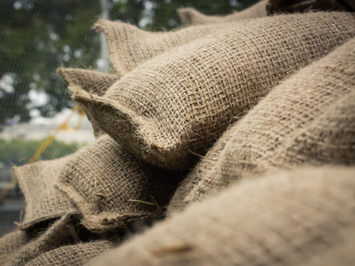 Hay bags filled with sand are then placed on the frame to cover the exterior.