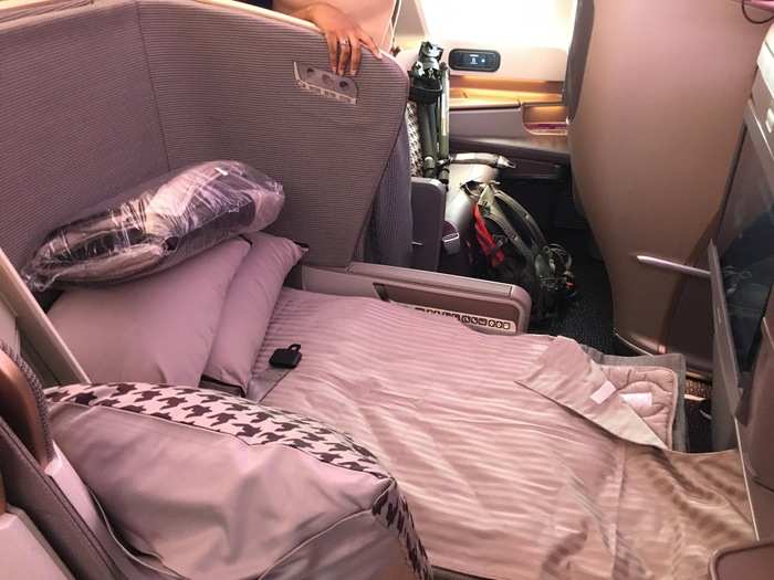 Or the seat can be folded forward and reconfigured into a 78-inch long bed. While the seat is leather, the padded bed is cloth. This allows your body to better regulate temperature while sleeping. Also, the bed looks a lot nicer when flights attendants set it up for you.