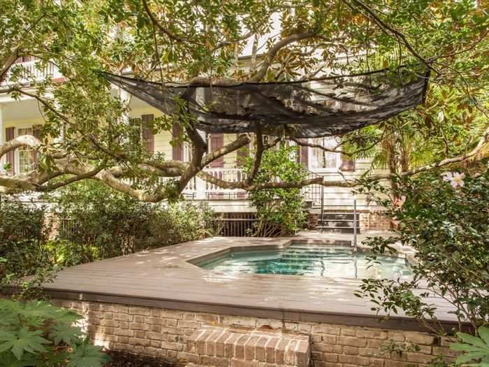 And a hot tub oasis sits unobstructed by fallen Magnolia leaves above.