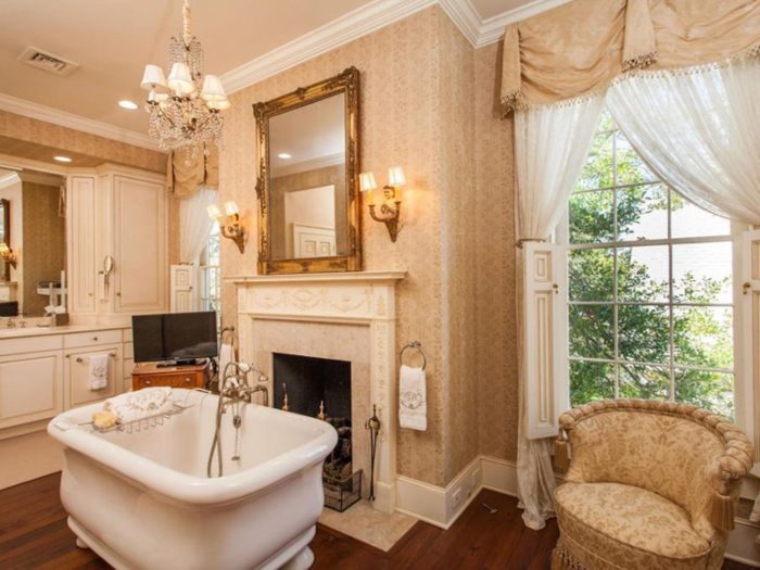 The master bathroom has a pristine freestanding tub, which was added during the home