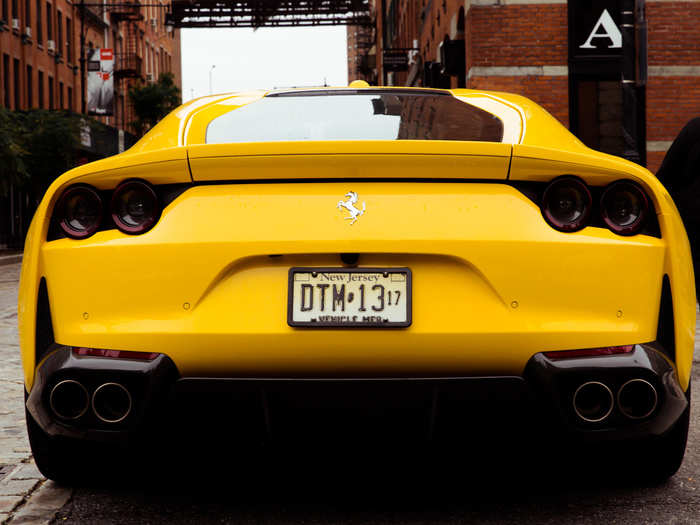 The fastback roof slopes to a spoiler lip — and a prancing horse in chrome.