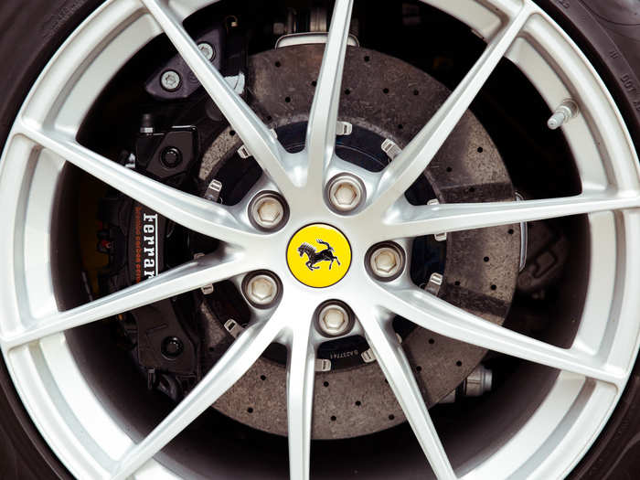 Ventilated carbon-ceramic brakes and massive Ferrari-branded calipers.