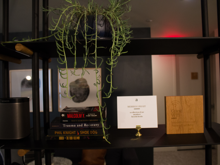 The bookshelves decorating the waiting areas at Alma are filled with its members