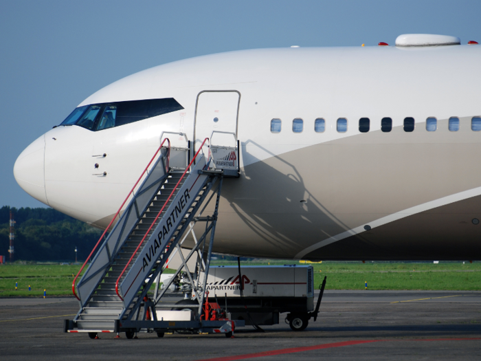 The customized interior of the aircraft includes a banquet hall that seats 30 people, a kitchen, an office, and a bedroom.