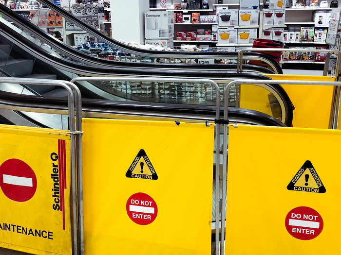 One of the escalators up to the third floor was completely closed off, and the other was not working.