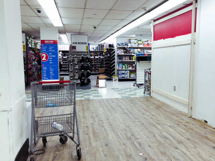 There was a huge empty space in the middle of the floor, and the wall was only partially painted. It looked unfinished.