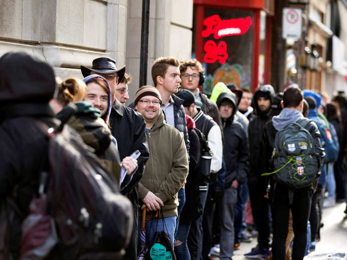 Many people stayed up overnight, queuing for the stores to open.