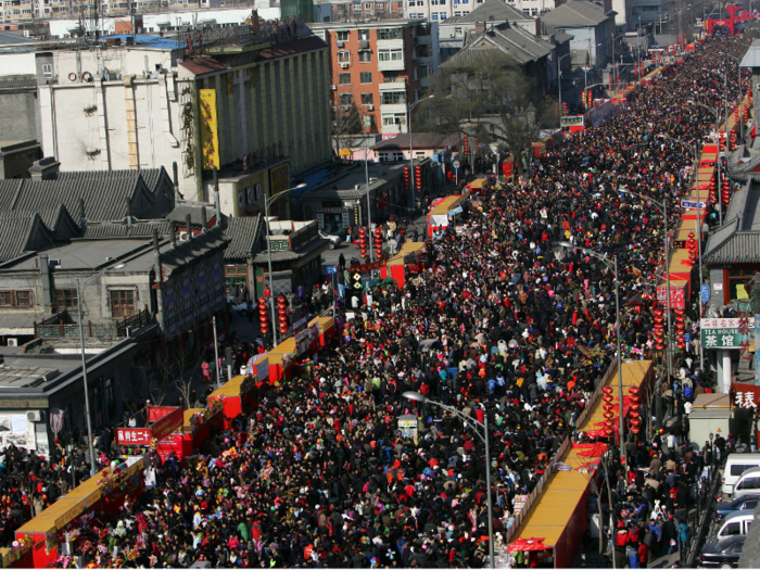 The Chinese New Year celebration in Beijing is a spectacle, but the crowds are so large the holiday is also referred to as the world