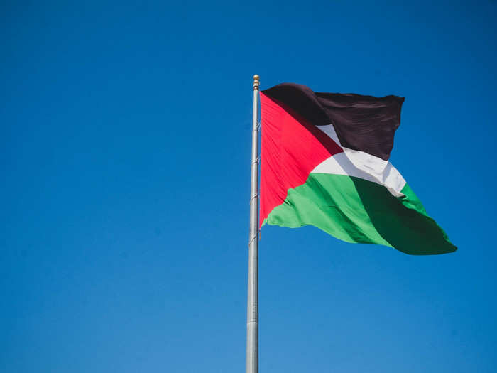 Rawabi is a symbol of Palestinians "defying the occupation," according to Masri, simply by existing. Sometimes in literal ways. The Palestinian flag that sits on a hill atop the city is the size of a living room.