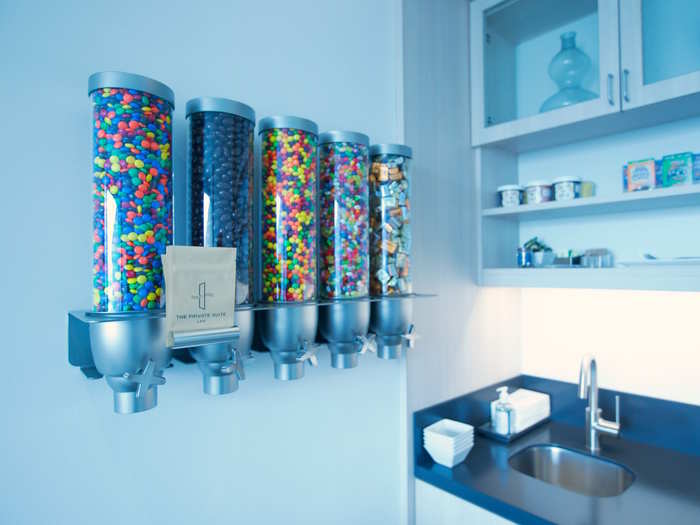 Every room is equipped with large candy dispensers and branded to-go bags.