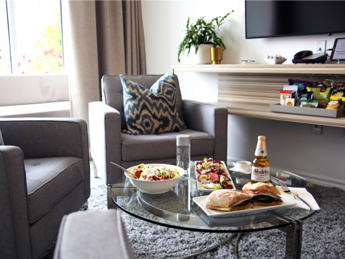 Members can pre-order fresh meals and snacks like chips and salsa, avocado toast, smoked salmon, gourmet salads, ramen noodles, and sandwiches to be waiting in their suite. The kids menu prominently features organic and gluten-free options.