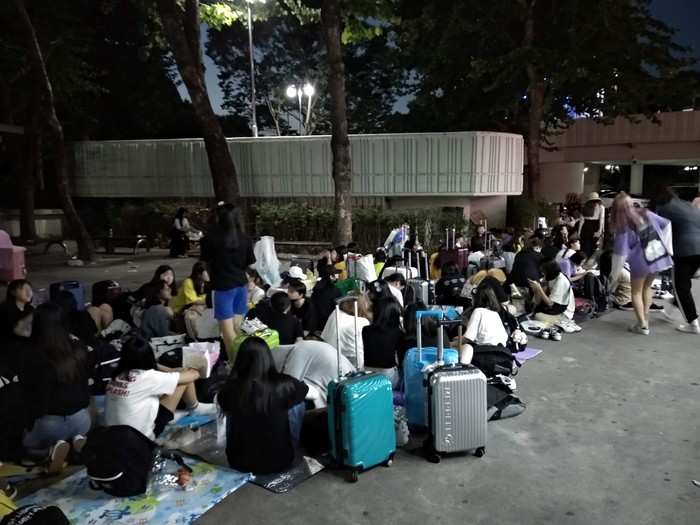 And of course, more suitcases, waiting for the merchandise stalls to open the next day. The entire experience was exhausting to say the least.