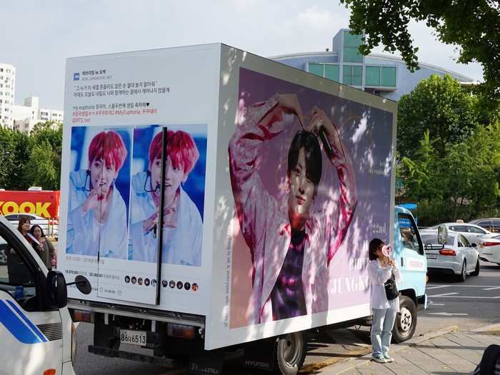 Vans and buses were decorated with massive pictures of favorite band members. These were, of course, all funded by various BTS Army fan clubs. This van was decorated to celebrate the birthday of BTS member Jungkook.