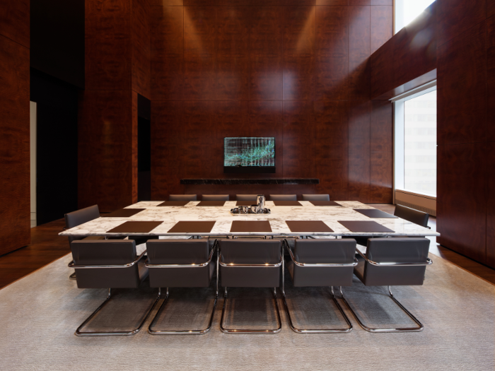 ... a conference room with a marble table that seats 14 ...