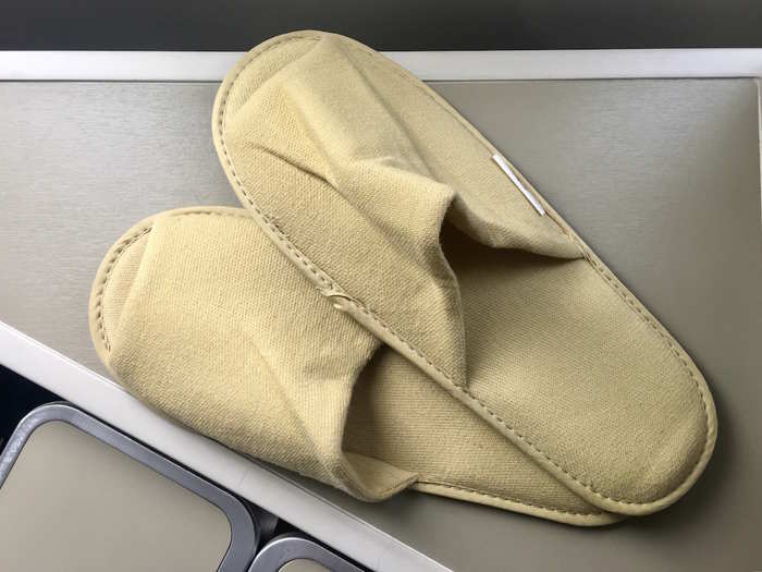 The seat came with a pair of comfortable slippers; I gladly stowed away my own shoes until we landed in Hanoi.